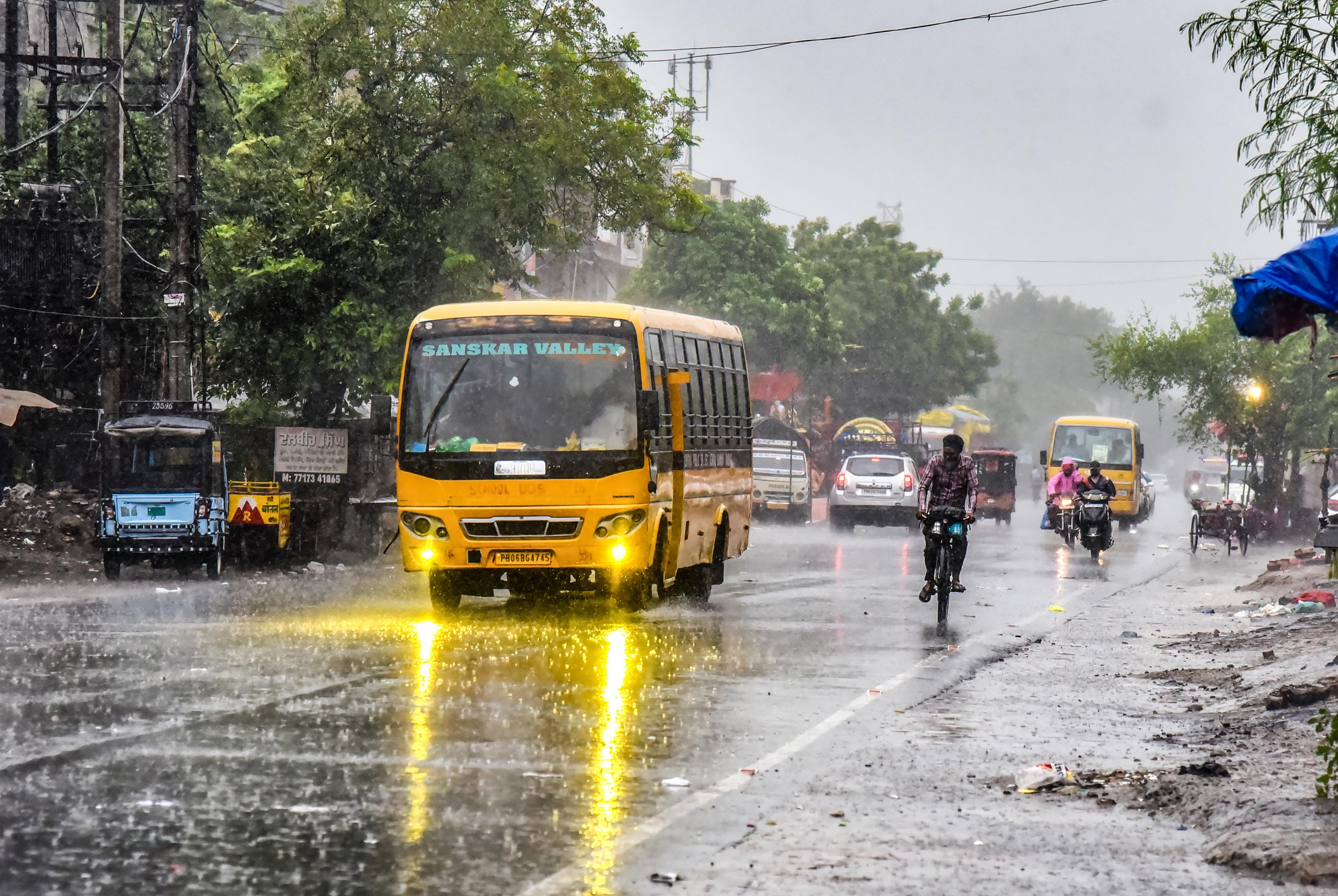 Amritsar: Commuters ride through monsoon rain