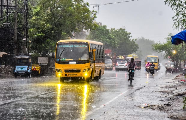 Amritsar: Commuters ride through monsoon rain