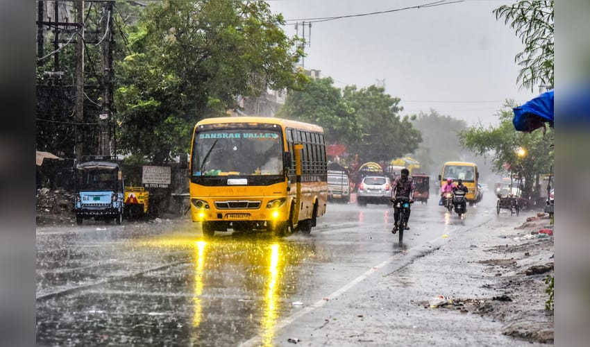 Amritsar: Commuters ride through monsoon rain