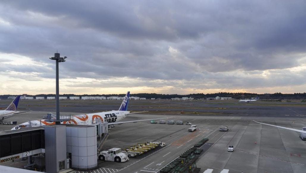 Black smoke seen near aircraft engine at Japan's Narita airport, runway closed