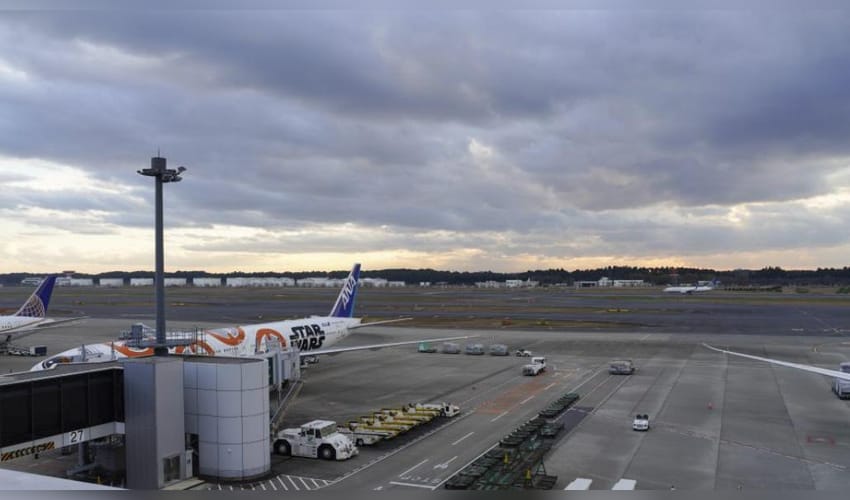 Black smoke seen near aircraft engine at Japan's Narita airport, runway closed