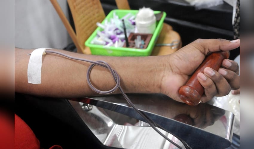 Health worker, blood sample, mobile blood donation van, blood donation camp