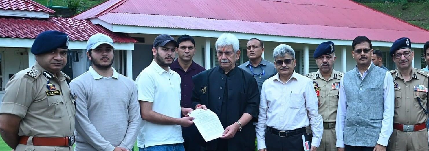 J&K L-G hands appointment letters to families of martyred policemen (Photo: IANS)
