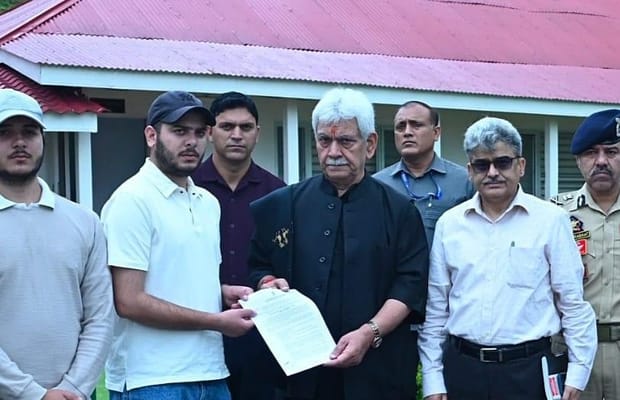 J&K L-G hands appointment letters to families of martyred policemen (Photo: IANS)