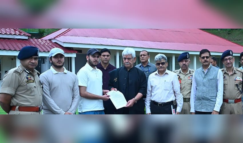 J&K L-G hands appointment letters to families of martyred policemen (Photo: IANS)