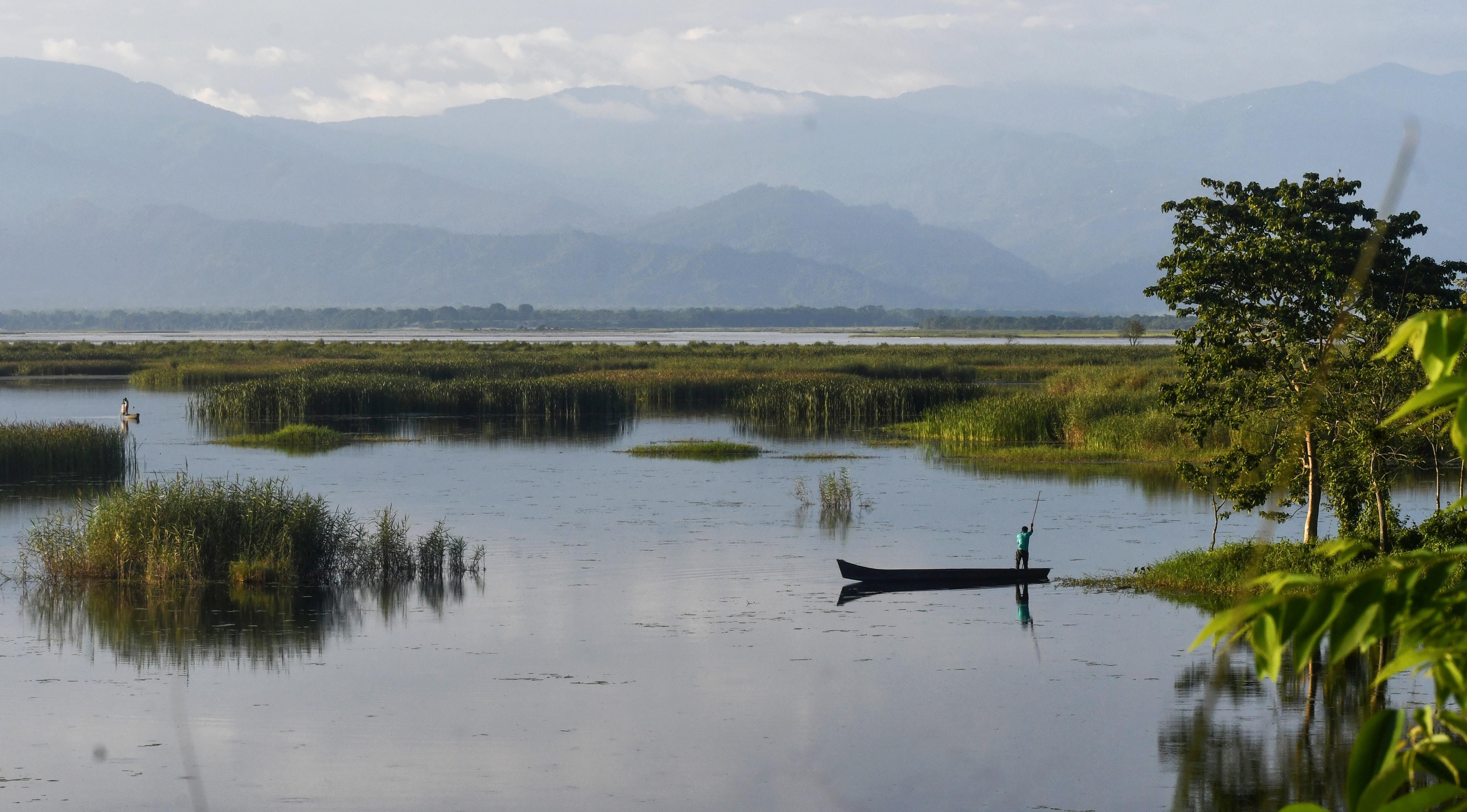 Jalpaiguri: Boatman Waits on the Teesta River After Rain
