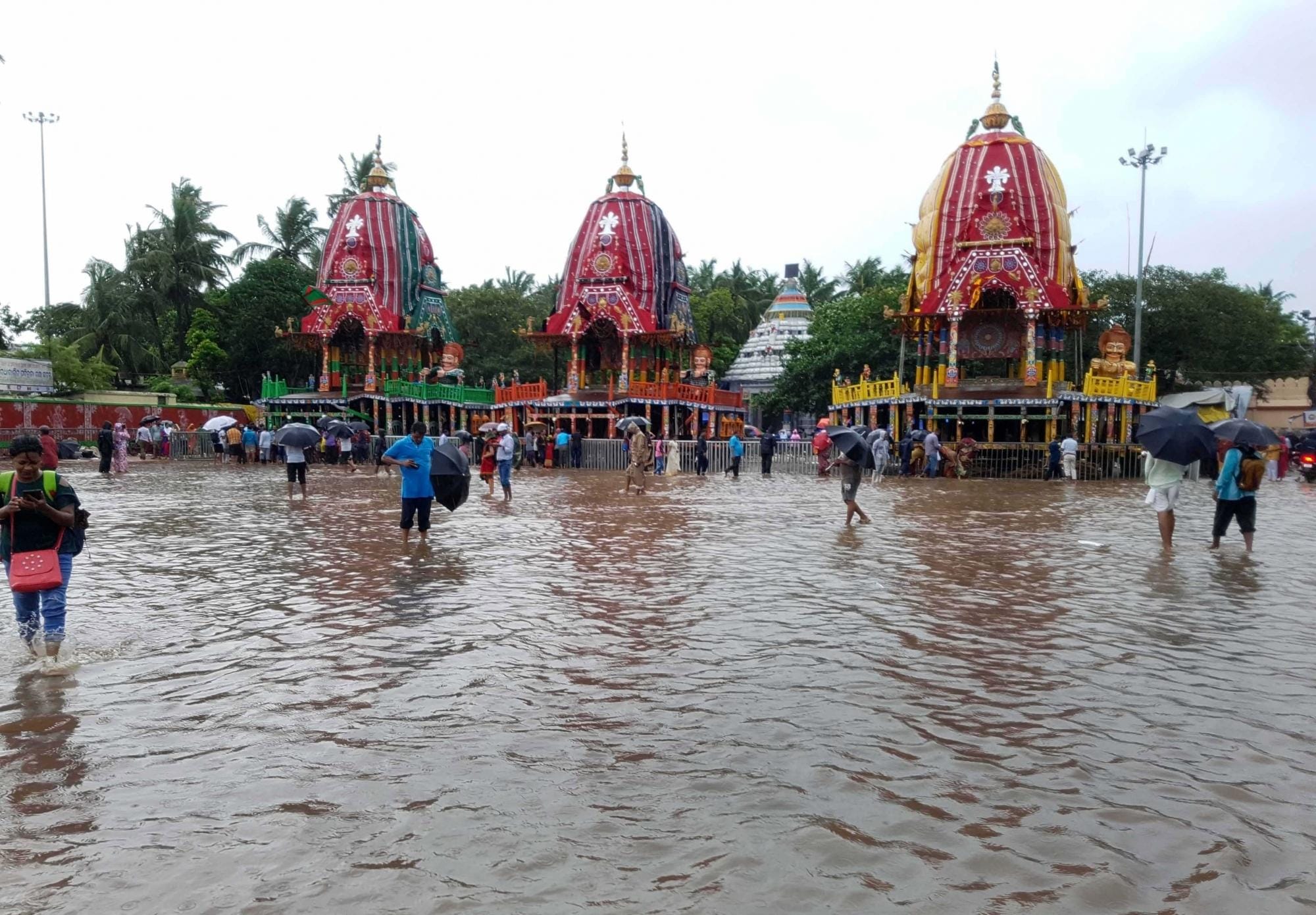 July 2018,Odisha,Odisha Floods,People wade through flood water