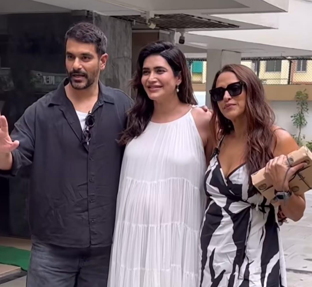 Karishma Tanna asks paps to stop focusing on her baby bump as she poses with Neha Dhupia, Angad Bedi