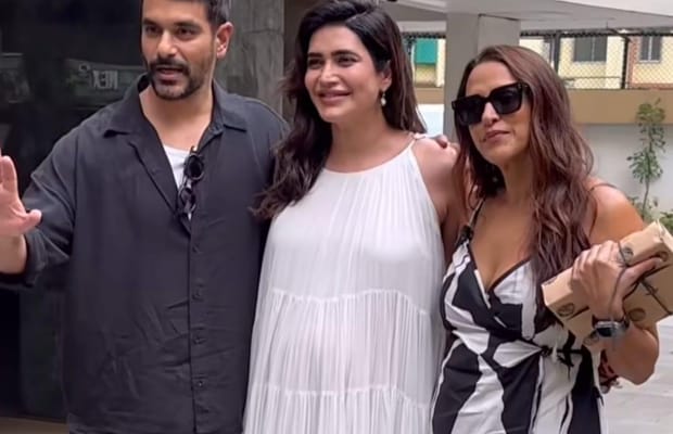 Karishma Tanna asks paps to stop focusing on her baby bump as she poses with Neha Dhupia, Angad Bedi