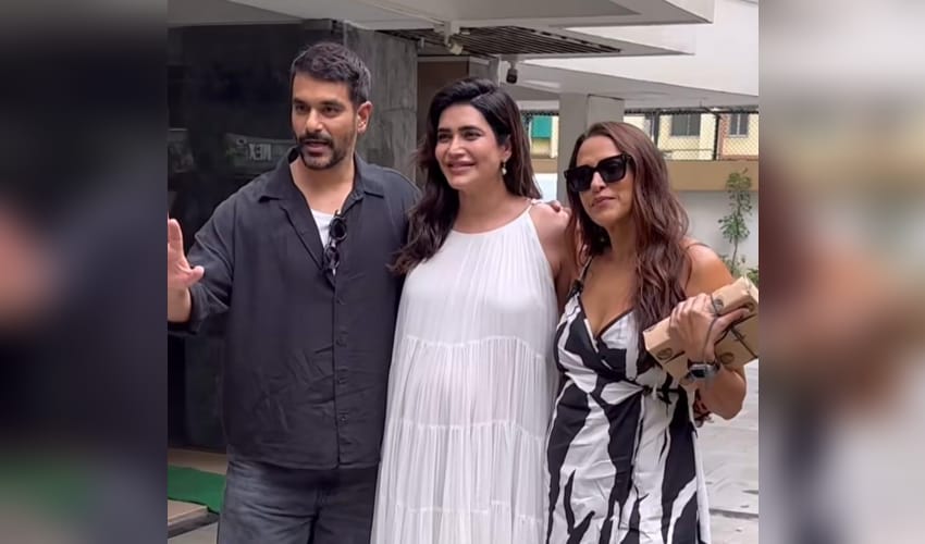 Karishma Tanna asks paps to stop focusing on her baby bump as she poses with Neha Dhupia, Angad Bedi