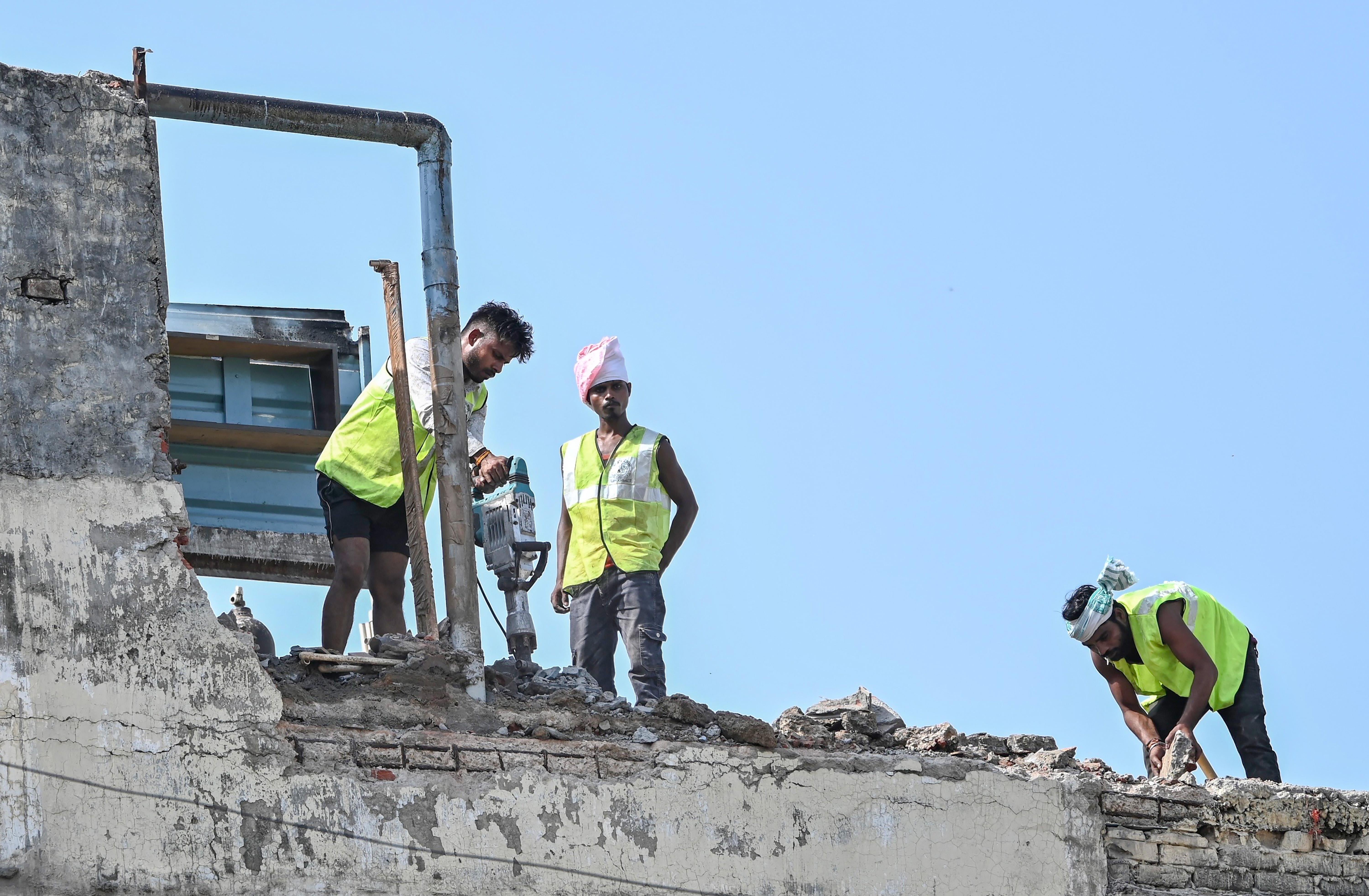 New Delhi: Adjoining building demolished after collapse at Satya Niketan