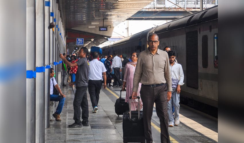 New Delhi: Passengers at New Delhi Railway Station