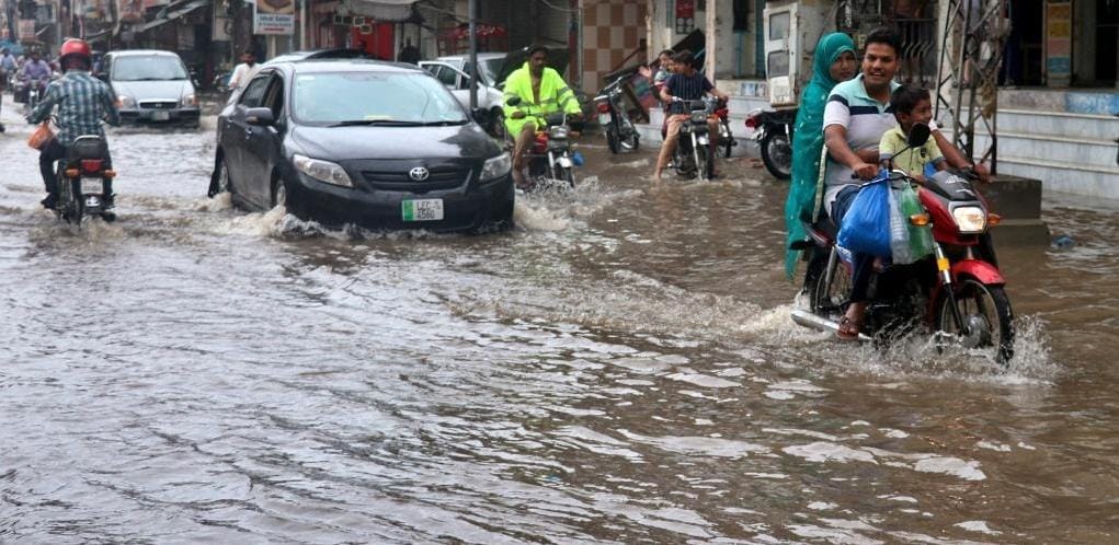People,flood,waterlogged street,Lahore,rain,Pakistan,