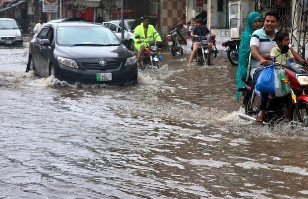 People,flood,waterlogged street,Lahore,rain,Pakistan,
