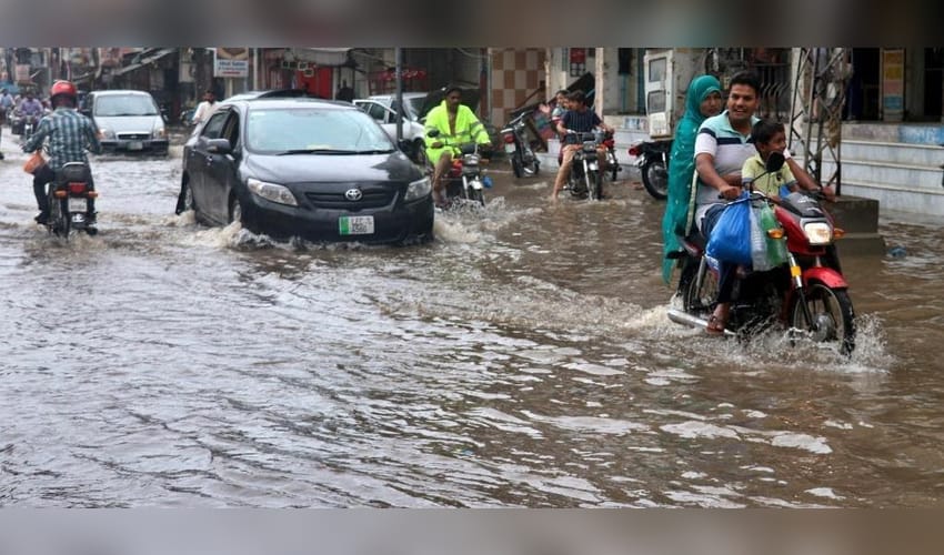 People,flood,waterlogged street,Lahore,rain,Pakistan,