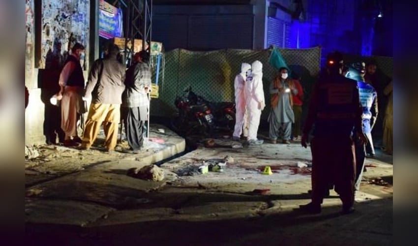 Security officers examine the blast site in Quetta, southwestern Pakistan, on Dec. 30, 2021,