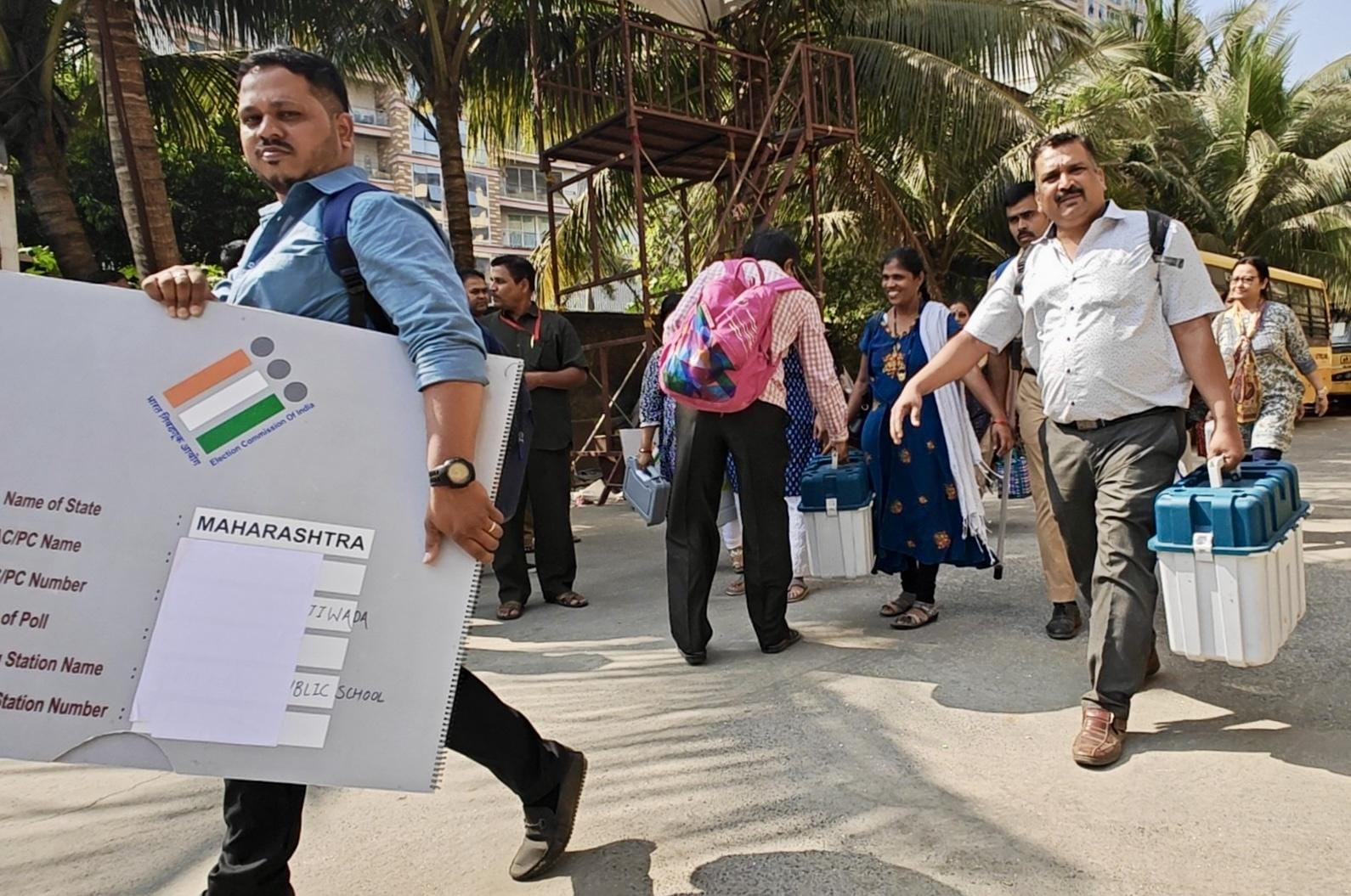 Thane: Polling officers with the Electronic Voting Machines (EVMs), ballot units, and other election-related materials leave for their respective polling booths 