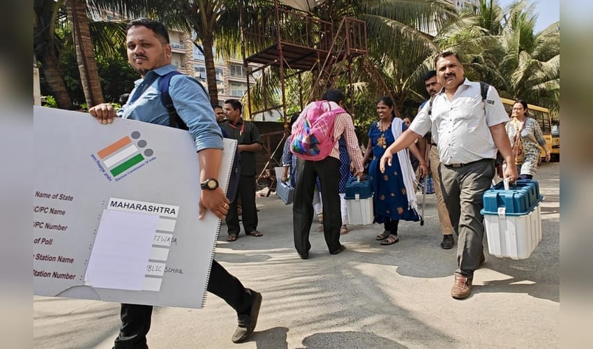 Thane: Polling officers with the Electronic Voting Machines (EVMs), ballot units, and other election-related materials leave for their respective polling booths